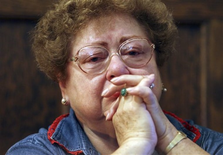 Irma Friedrich, a parishioner at St. Emeric's Church, cries during a prayer service Wednesday, June 30, 2010.  Bishop Richard Lennon was supposed to conduct the final service at the church but cancelled it, leaving parishoners to hold their own service.  The church is the last of 50 parishes to close its doors, ending a massive downsizing of mostly older, ethnic parishes decreed by the Roman Catholic Diocese of Cleveland because of falling attendance, a priest shortage and financial problems. (AP Photo/The Plain Dealer, Gus Chan) MANDATORY CREDIT